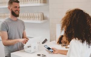 Small business owner using AI technology on laptop