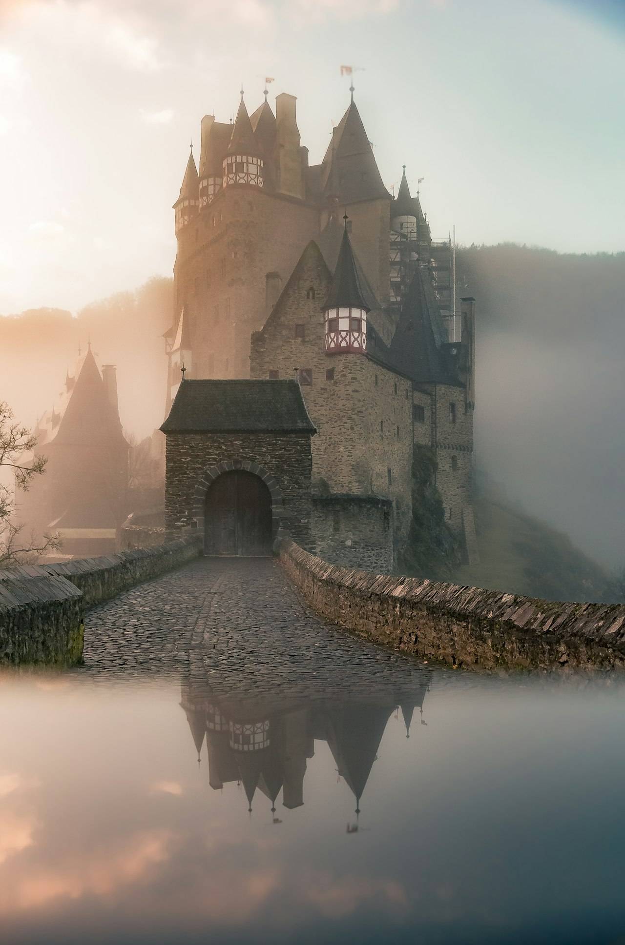 Castle in misty landscape for AFK Journey article