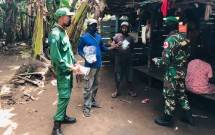 Satgas Yonif 125/SMB-Babinsa, Babinkamtibmas- Kepala Kampung Cegah Penyebaran Covid-19