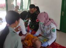 Satgas Pamtas Yonif Raider 142 KJ Bersinergi Gelar Posyandu Di Wilayah Tolikara