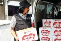 Tim SiCepat Tanggap (SIGAP) saat menyalurkan paket bantuan sembako dalam rangka Hari Pahlawan.