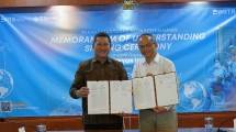 Direktur Utama PT Surveyor Indonesia, Sandry Pasambuna dan Regional Director South East Asia Dimitra Incorporated, Ricky Tanudibrata. 
